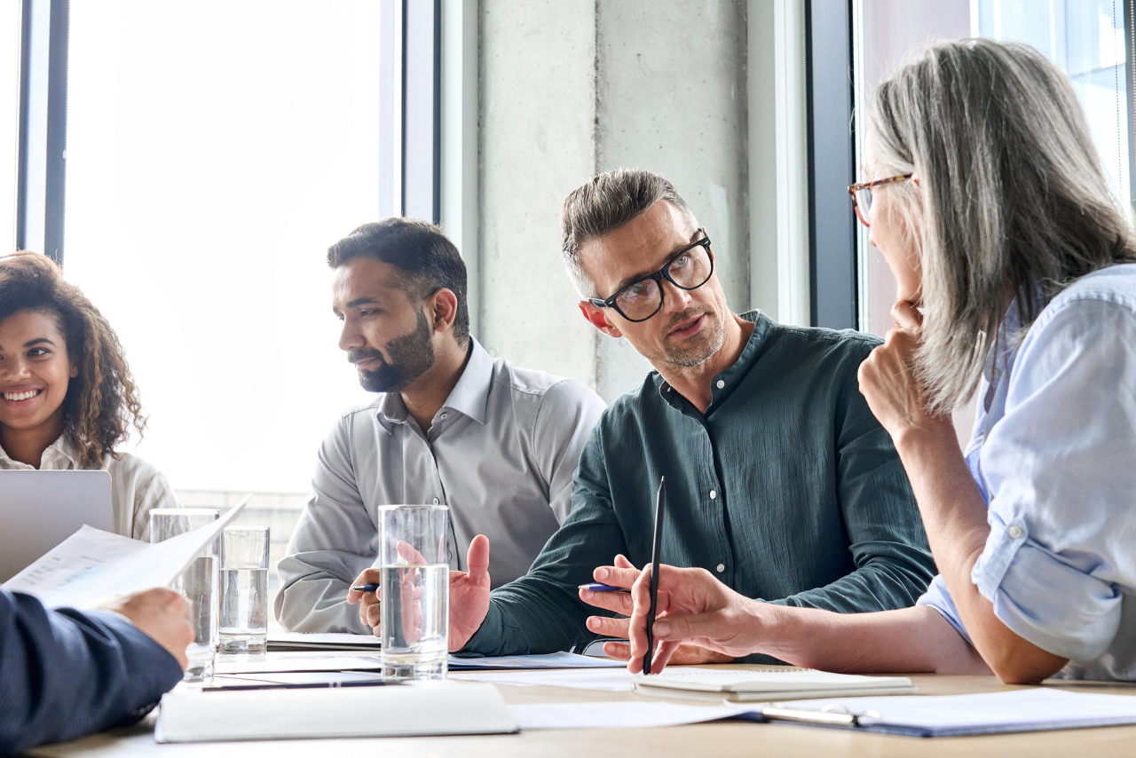 leadership team sitting at a conference table